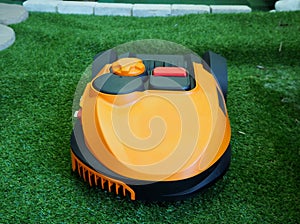 Robot lawn mower on grass, Close up and front view