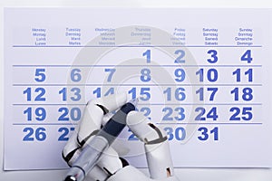 Robot Marking Date On Calendar