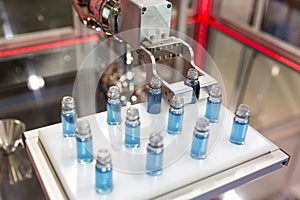 Robot mechanical arm with chemical tubes in a medical laboratory