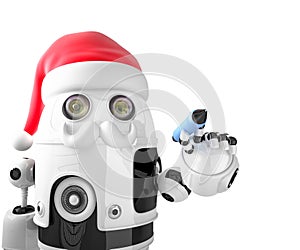 Robot Santa Claus holding a pen. Isolated. Contains clipping path