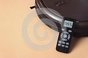 Robot vacuum cleaner automate with Remote Control. clean floor machine. housework and technology concept