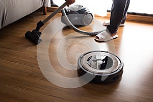 Robot vacuum cleaner with people mop the floor.Smart life