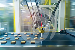 robot with vacuum suckers with conveyor in Production of cookies