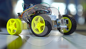 Robot on wheels constructed by programmers at a robotics competitions. Education of children