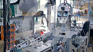 A robot in workshop with all inner parts visible.