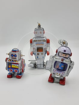 Robot world with three tin toy robots
