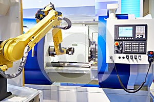 Robotic arm and cnc lathe photo