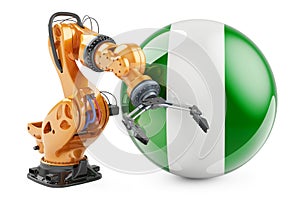 Robotic arm with Nigerian flag. Modern technology, industry and production in Nigeria concept, 3D rendering