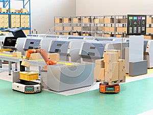 Robotic arm picking parcel from conveyor to AGV photo