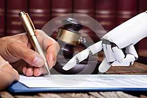 Robotic Hand Assisting Person For Signing Document