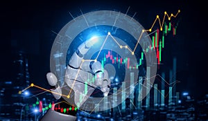 Futuristic robotic hand interacting with digital financial graphs and data visualization, showcasing technology and