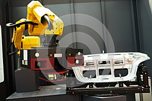 Robotic industry. Robot with 3D sensor scanner measures surface of detail in automotive industry