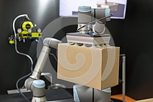 Robotic or robot arm for cardboard box packing