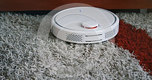Robotic vacuum cleaner on carpet rug floor smart cleaning technology