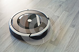 robotic vacuum cleaner on laminate wood floor smart cleaning technology