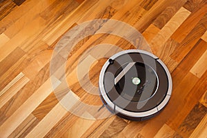 robotic vacuum cleaner on laminate wood floor smart cleaning technology