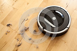 robotic vacuum cleaner on laminate wood floor smart cleaning technology dust