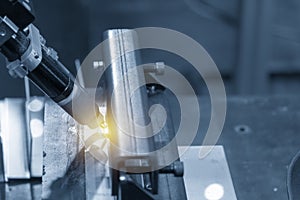 The robotic welding the square tube in the light blue scene with the lighting effect.