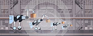 Robotic workers loading cardboard boxes hi-tech smart factory warehouse interior logistics automation technology concept