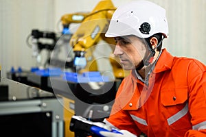 Robotics controller engineer working and solving problems on machine