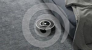 Robots vacuums cleaners on carpet in living room