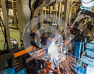 Robots welding machine in a car factory