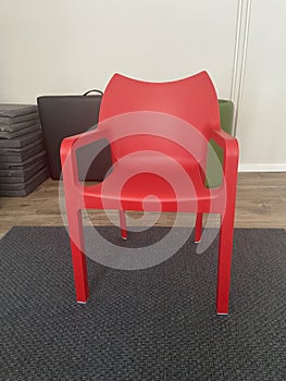 Robust Red Chair on the Gray Carpet