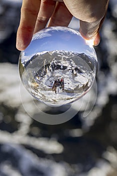 Roc Del Quer trekking trail observation deck, reflection view through crystal ball. Andorra. photo