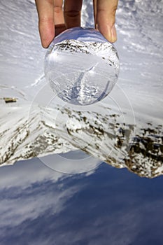 Roc Del Quer trekking trail, reflection view through crystal ball. Andorra. photo
