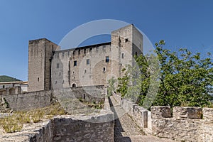 The Rocca Albornoziana overlooking the historic center of Spoleto, Italy, on a sunny day photo