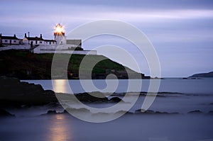 Roches Point Lighthouse in Cork at Dusk photo