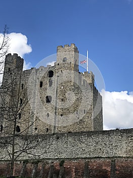 Rochester castle in Kent, United Kingdom, with its flag at half mast