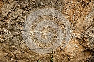 rock animals of deer of ancient people on stone cliff. Charvak