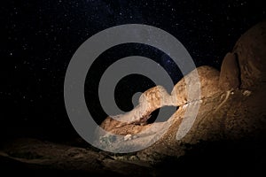 Rock arch at night.