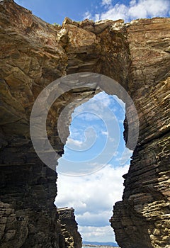 Rock arch at Playa de las Catedrales photo