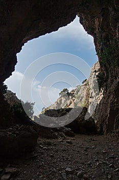 Rock arch on trekking trail at Imbros gorge near Chora Sfakion, island of Crete photo