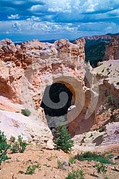 Rock Arch under thunder clouds at Bryce Canyon