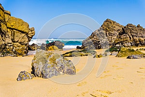 Rock on Atlantic ocean coastline of Adraga beach, Portugal