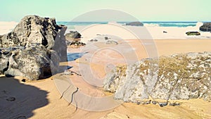 Rock on Atlantic ocean coastline of Adraga beach, Portugal coast