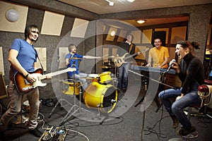 Rock band in studio. the joy of creation photo