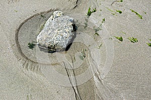 Rock on the beach creates art