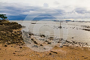 rock beach and the rain is comming at sriracha, Chonburi, Thailand