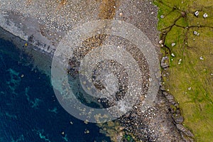 Rock beach in Sandoy island - aerial drone view