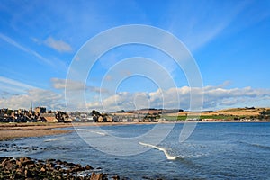 Rock and beach at Stonehaven bay on Sunny day