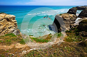 Rock at beach in summer day. Cantabric coast photo