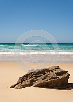 Rock at the beach on sunny summers day