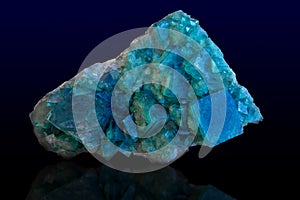 Rock of blue calcite mineral on dark background. photo