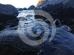 rock breaking waves on Manado beach