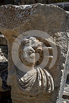 A rock carving depicting a human face at the ancient site of Myra in Demre in Turkey.