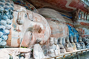 Rock carving of Sakyamuni Buddha entering Nirvana, with his disciples